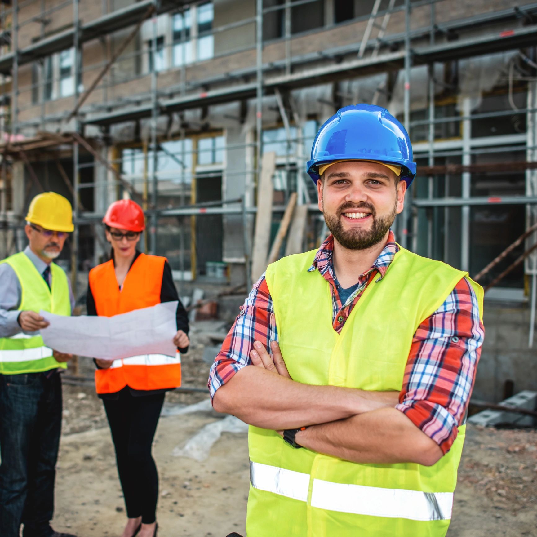 Workers in hard hats outdoors
