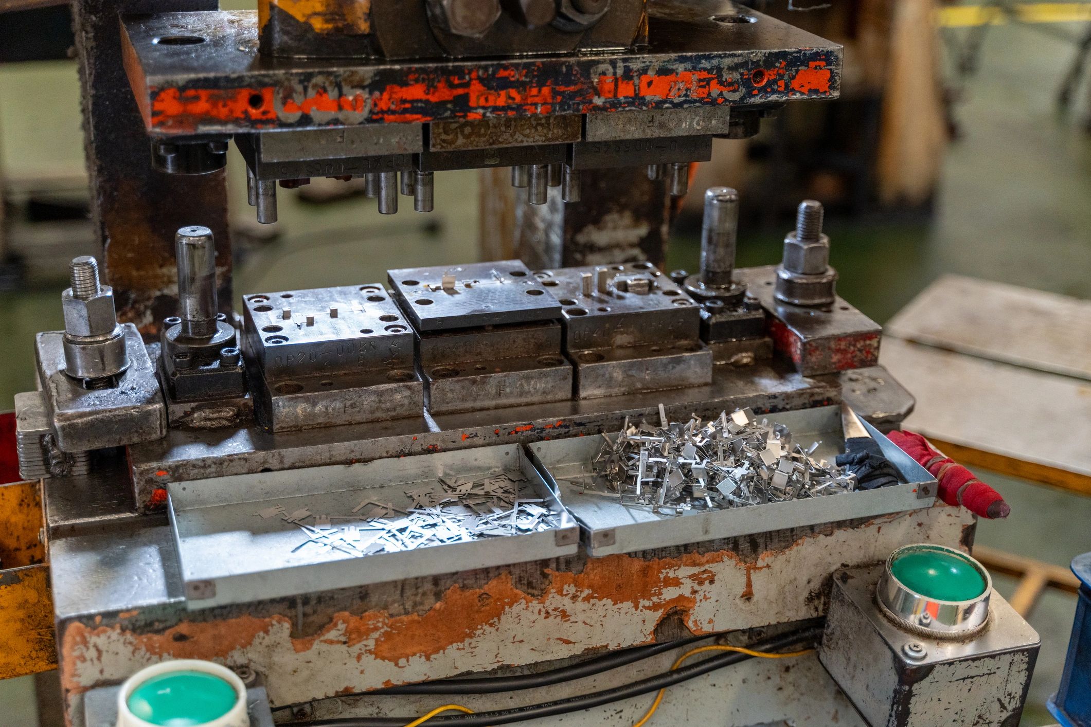 Metal parts on an industrial press machine