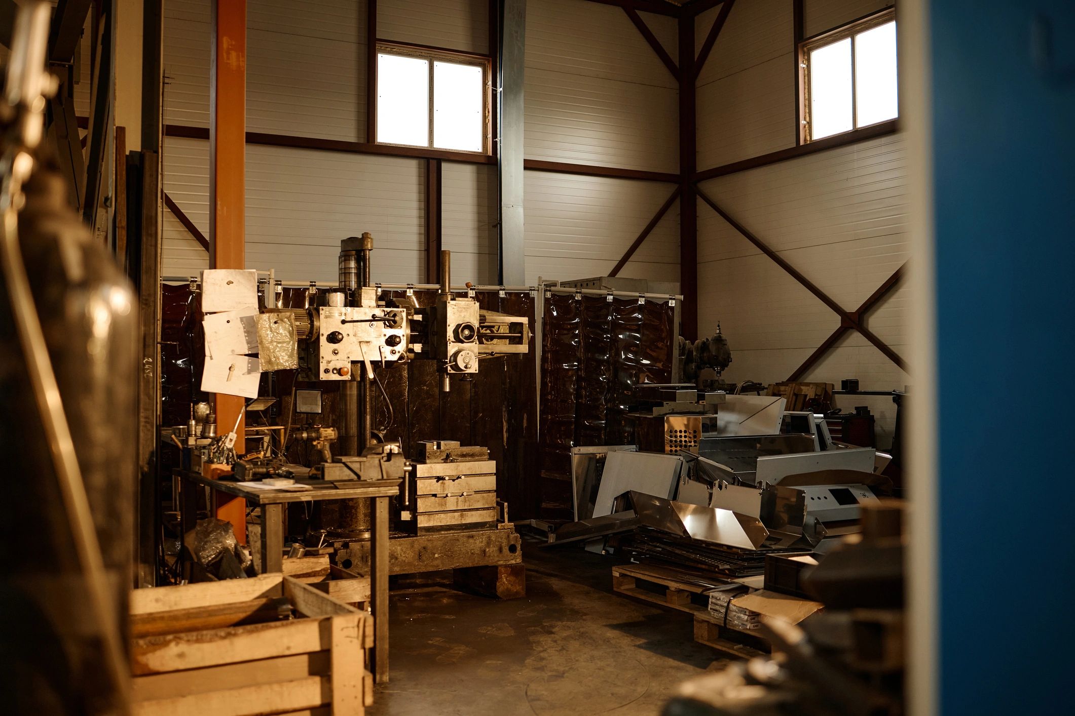 Metal fabrication workspace with industrial equipment